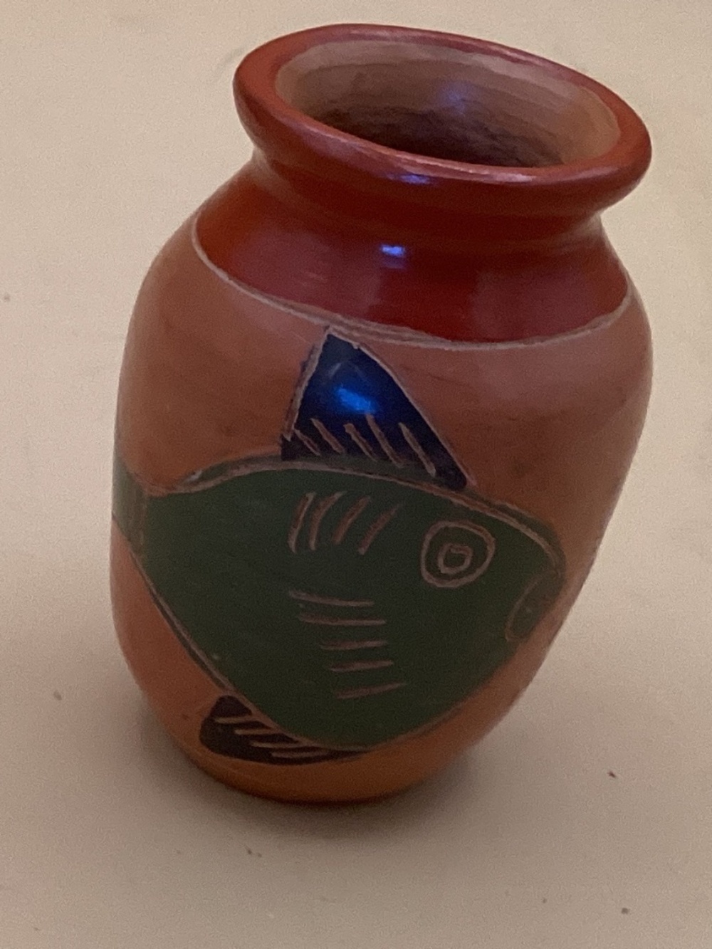 Small Vase painted with fish on front and back.
